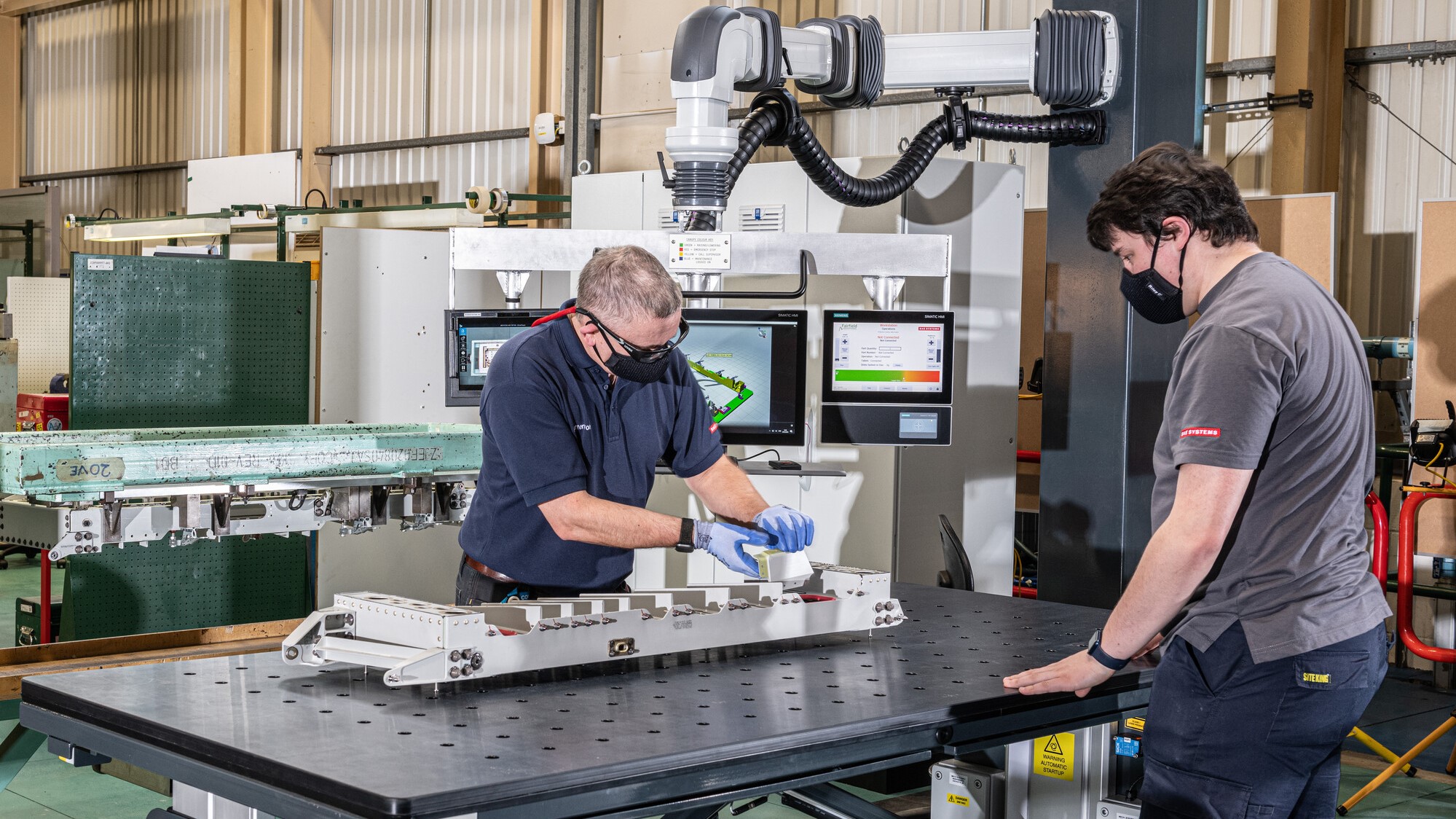 Employees working inside the hangar