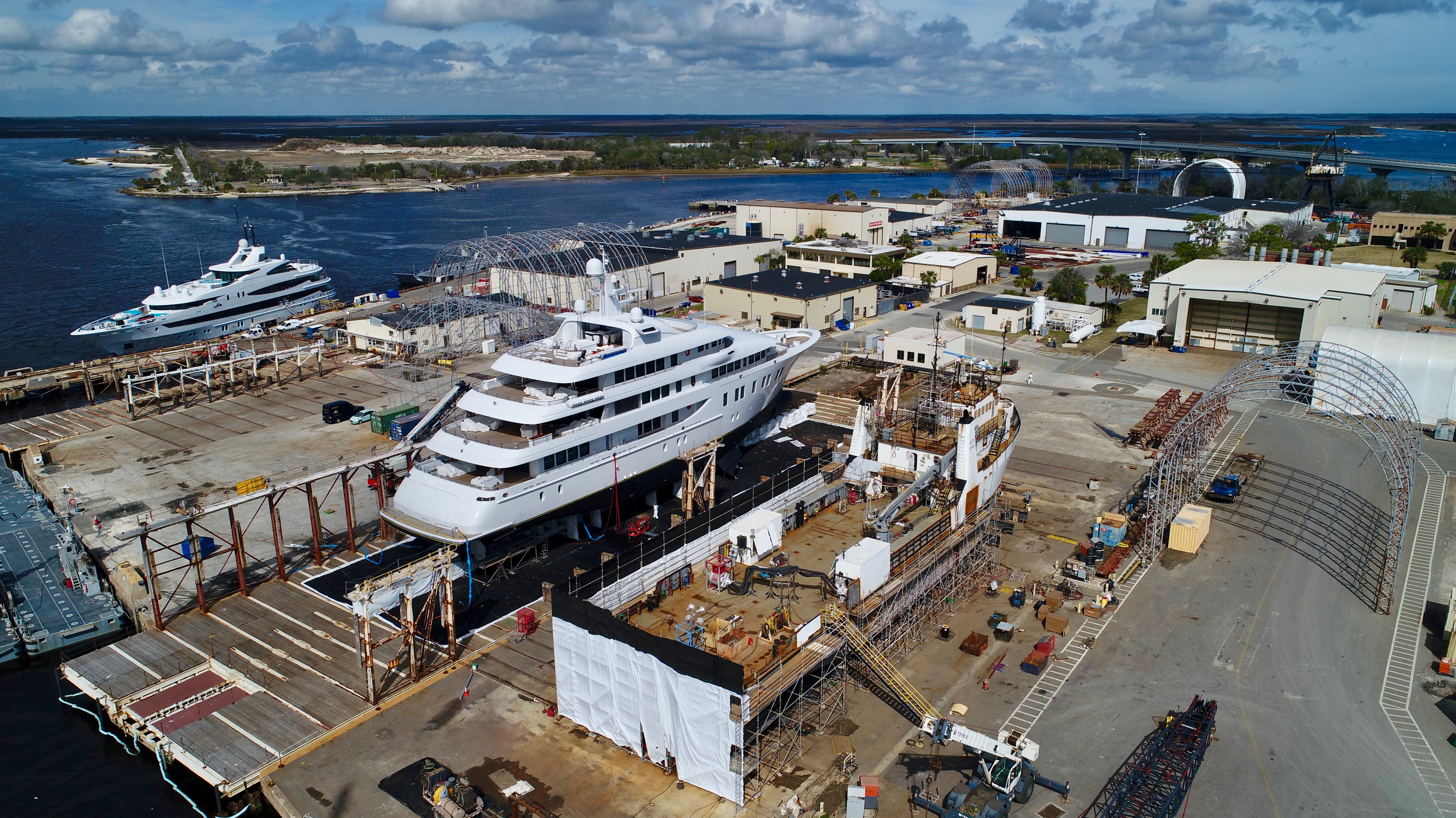 An aerial view of yachts docked for service