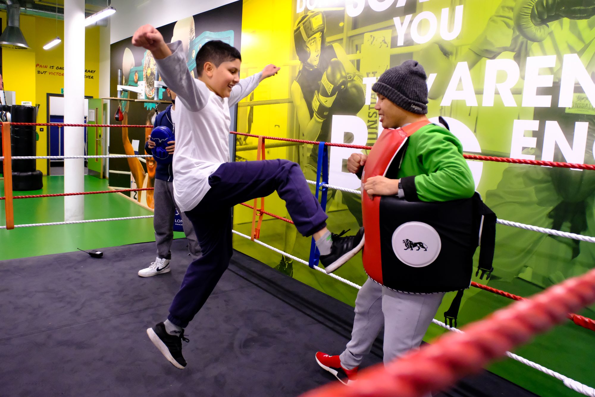 Two young boys learn martial arts