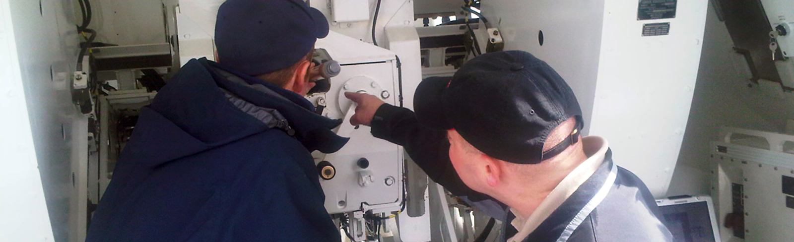 Two men working on machinery