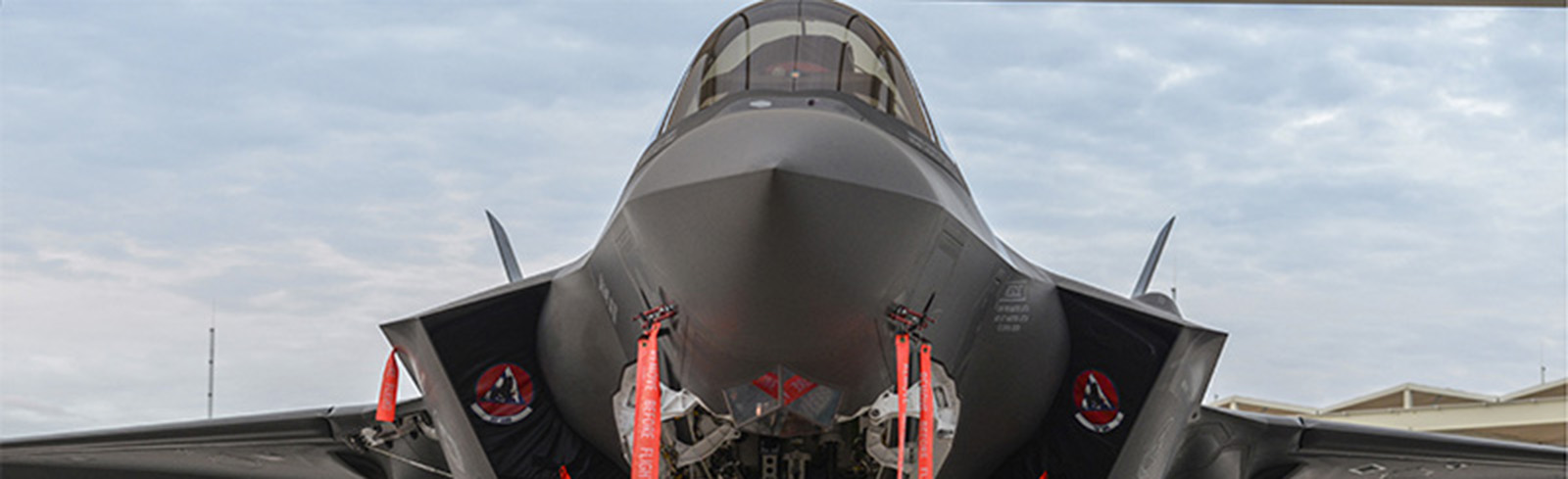An airman performs an inspection on an F-35A Lightning II at Luke Air Force Base