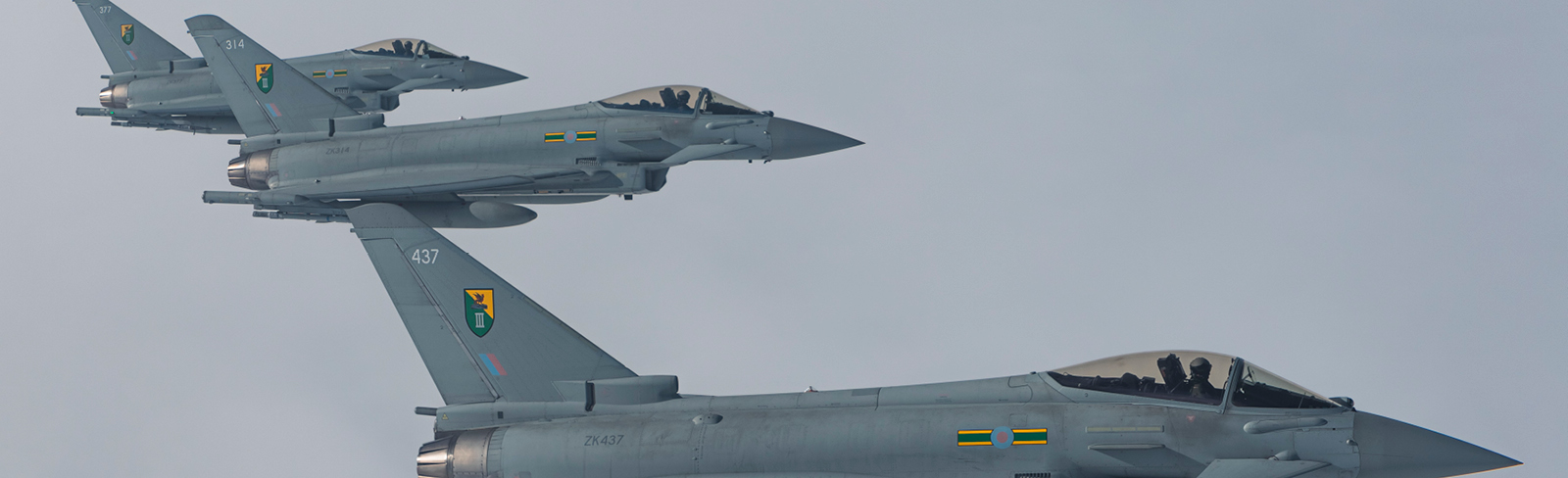 Three Typhoons from the RAF fly in formation.