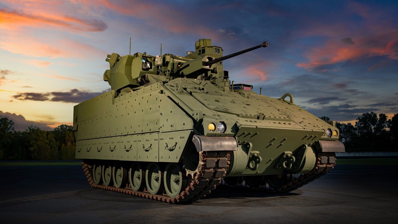 An Army green RB301, the new concept Infantry Fighting Vehicle rolling lab developed by BAE Systems, proudly sitting against an early morning sky.