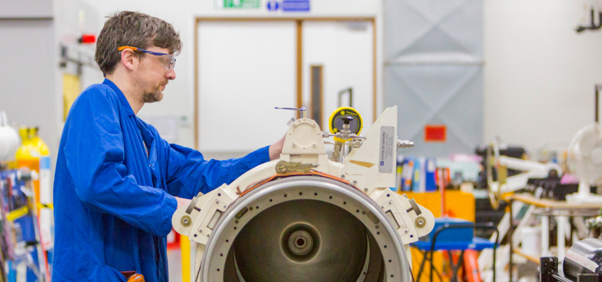 Man testing the casing of an underwater weapon
