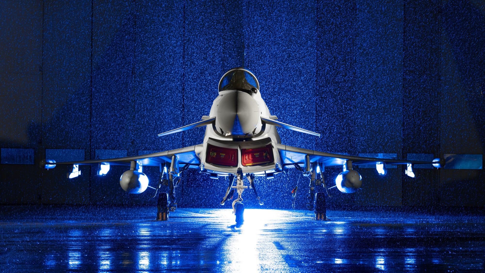A Eurofighter Typhoon bathed in blue light