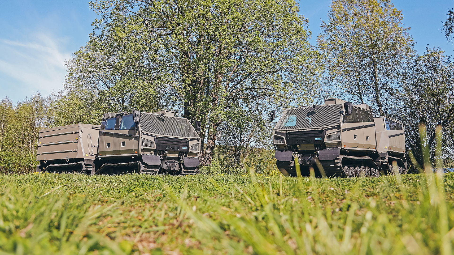 Two Beowulf vehicles angled toward each other in a field