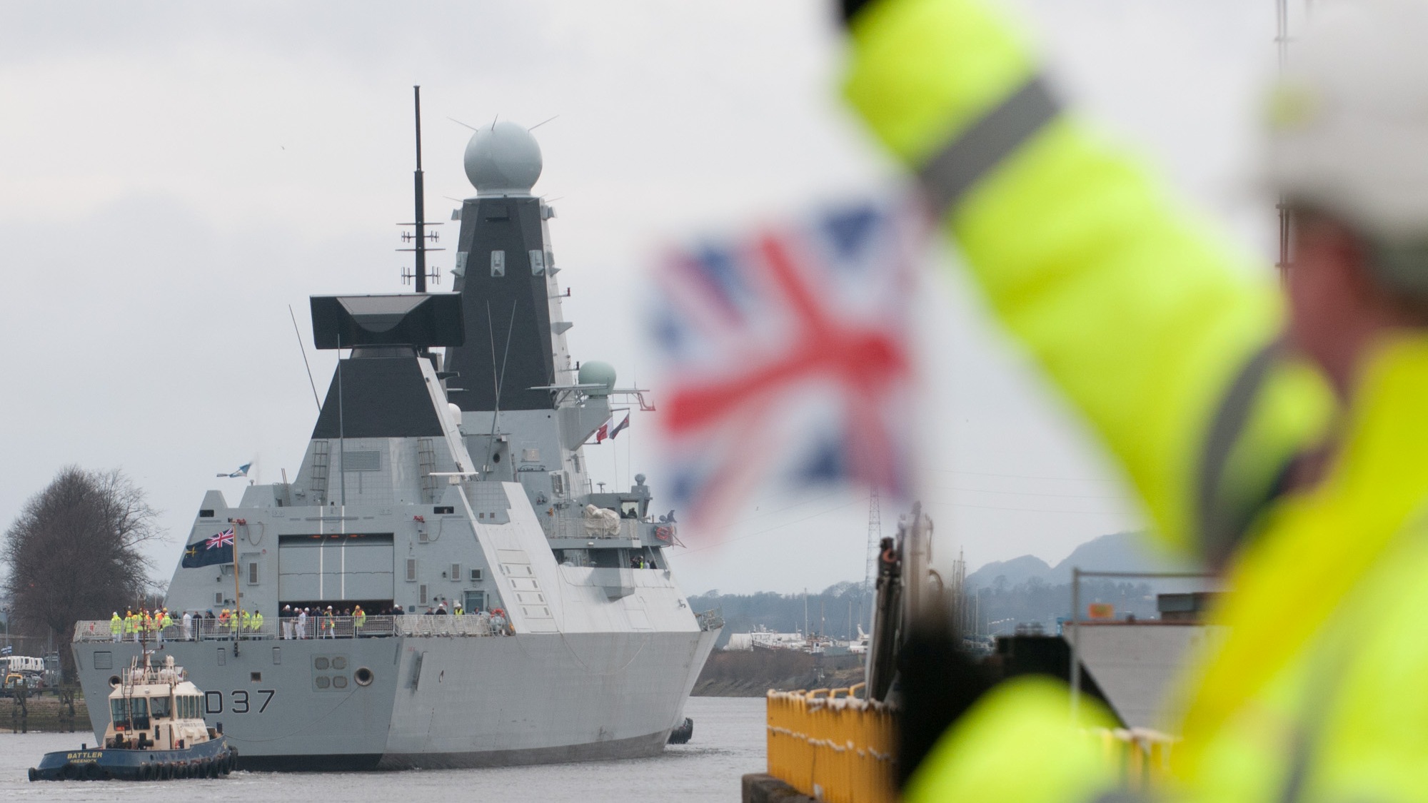 Employees wave off HMS Duncan on her delivery voyage from the Clyde