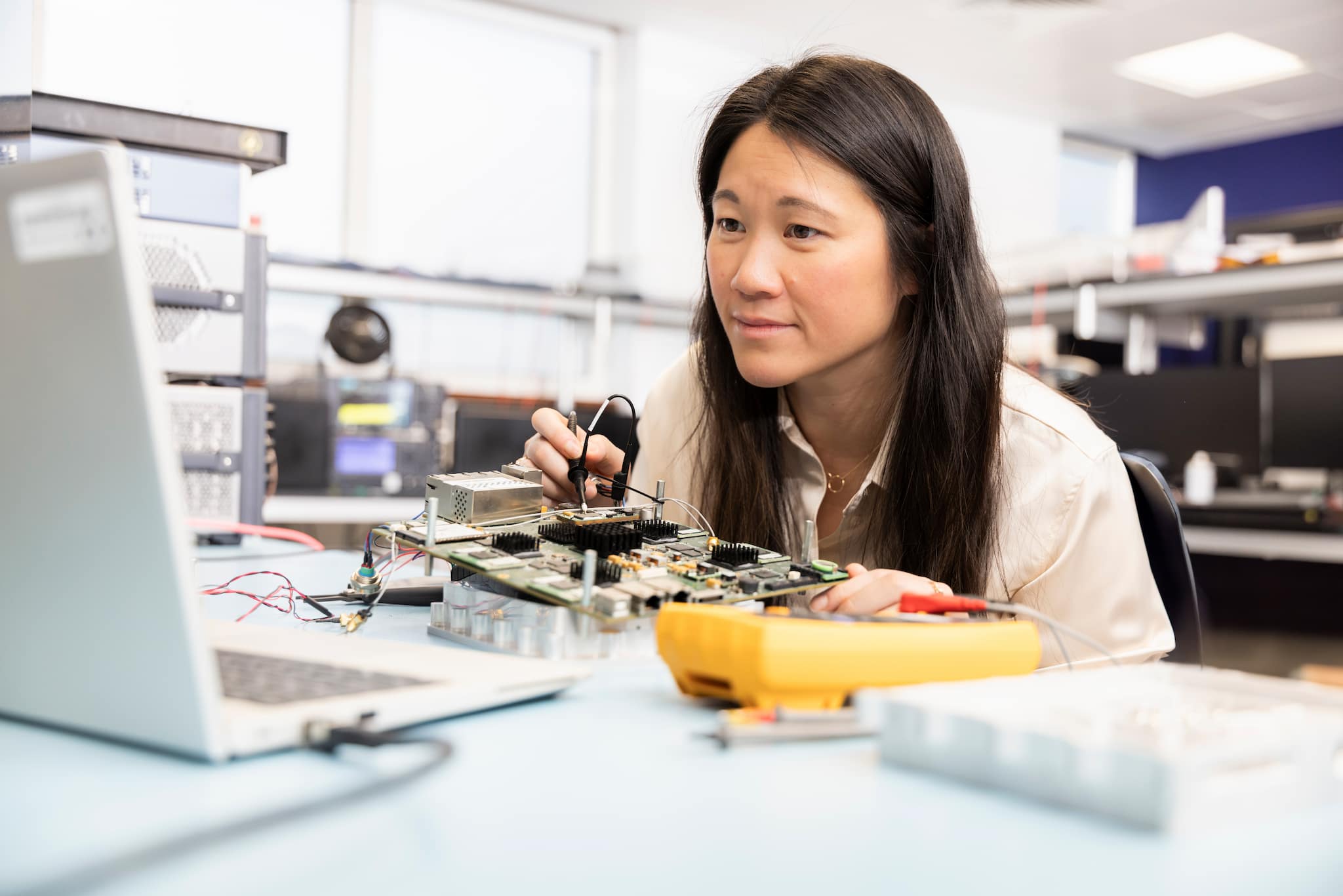 Employee building a circuitboard