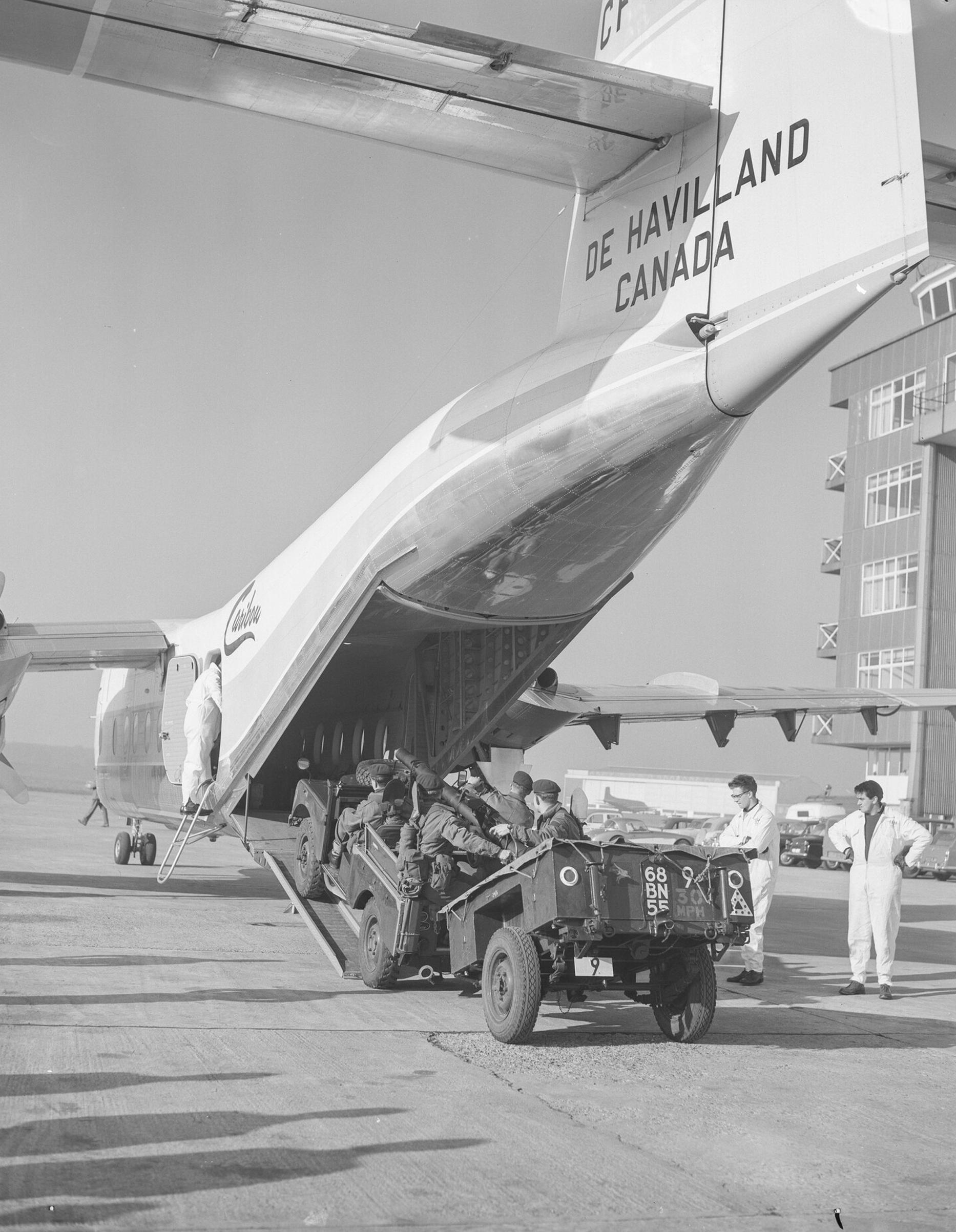 de Havilland Canada DHC-4 Caribou, ground view loading jeeps, 1958.