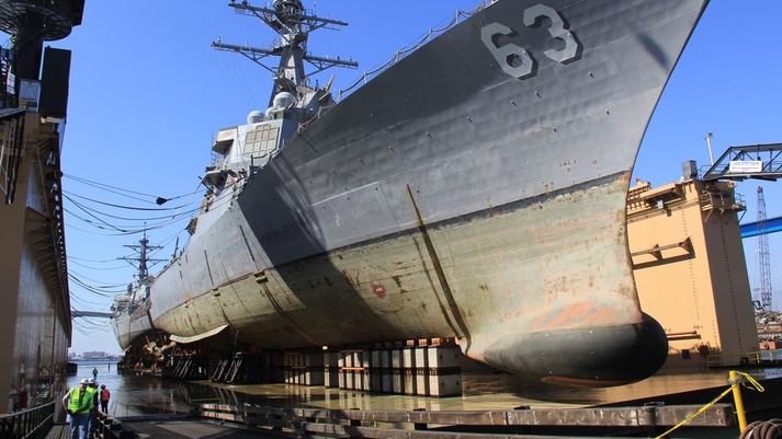 After more than 18 hours of positioning and dewatering, USS Stethem (DDG 63) and USS Decatur (DDG 73) are high and dry, awaiting the start of repair and maintenance work by BAE Systems. After more than 18 hours of positioning and dewatering, USS Stethem (DDG 63) and USS Decatur (DDG 73) are high and dry, awaiting the start of repair and maintenance work by BAE Systems.