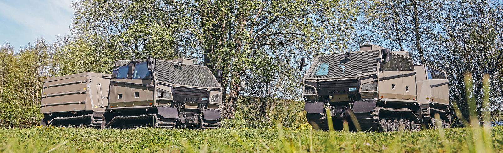 Two Beowulf vehicles angled toward each other in a field