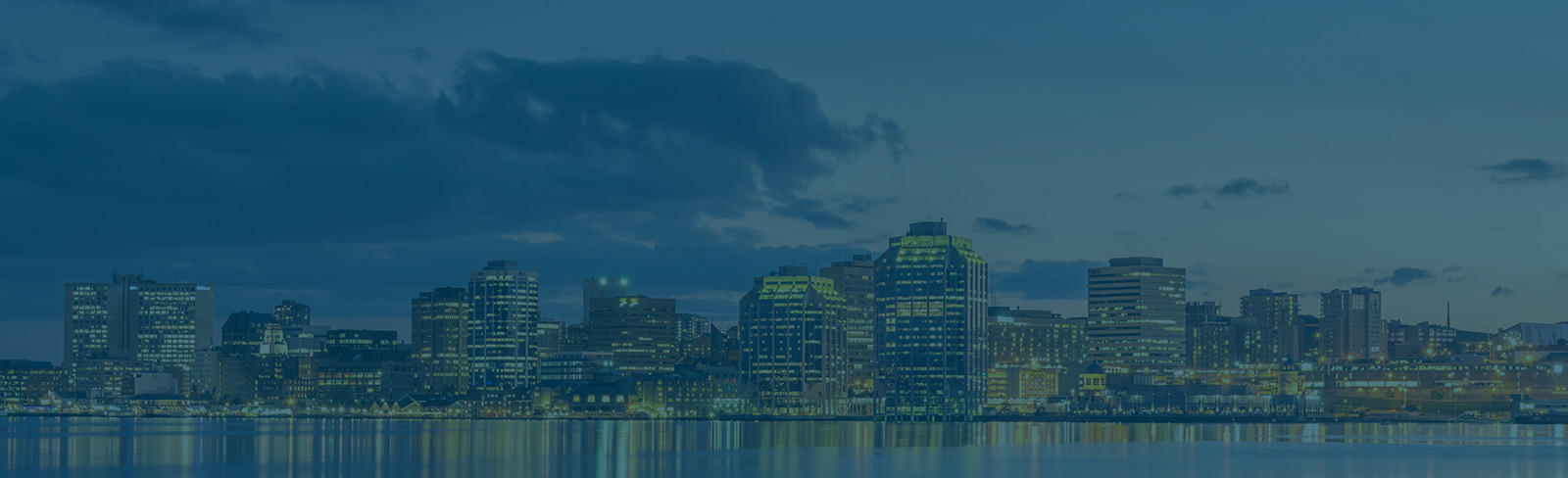 Halifax shoreline at sunset with a blue overlay