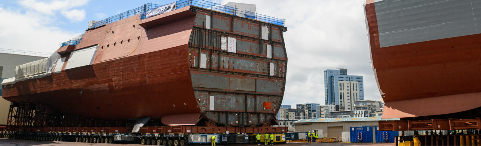 Fore and aft sections of HMS Cardiff on the hard standing in Govan.