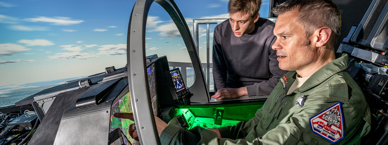 Pilot and engineer look at Large Area Display cockpit